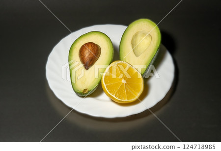 Avocado on a black background Avocado on a black background 124718985