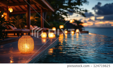 Serene evening poolside scene with glowing lanterns, tropical ambiance, and tranquil ocean view 124719825
