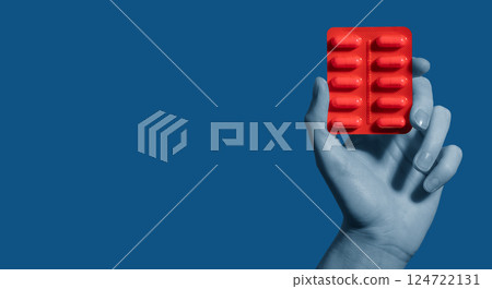 Hand holding capsule. Woman taking vitamin, medicine, supplement for health, treatment, care, 124722131