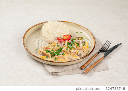 Portion of chicken fricassee with rice 124722746