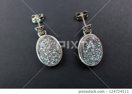 Unique earrings for women on a black background, promotional photo for an online vintage and handmade jewelry store Unique earrings for women on a black background, promotional photo for an online vintage and handmade jewelry store 124724511