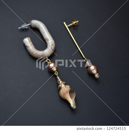 Unique earrings for women on a black background, promotional photo for an online vintage and handmade jewelry store 124724515