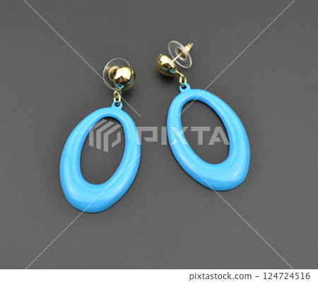 Unique earrings for women on a black background, promotional photo for an online vintage and handmade jewelry store 124724516
