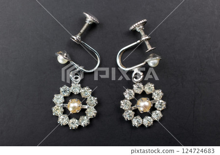 Unique earrings for women on a black background, promotional photo for an online vintage and handmade jewelry store Unique earrings for women on a black background, promotional photo for an online vintage and handmade jewelry store 124724683