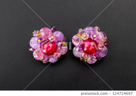 Unique earrings for women on a black background, promotional photo for an online vintage and handmade jewelry store 124724697