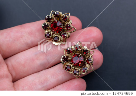 Unique earrings for women on a black background, promotional photo for an online vintage and handmade jewelry store Unique earrings for women on a black background, promotional photo for an online vintage and handmade jewelry store 124724699