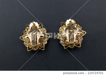 Unique earrings for women on a black background, promotional photo for an online vintage and handmade jewelry store Unique earrings for women on a black background, promotional photo for an online vintage and handmade jewelry store 124724701