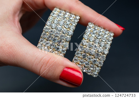 Unique earrings for women on a black background, promotional photo for an online vintage and handmade jewelry store 124724733