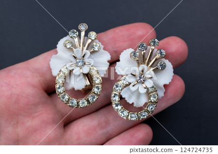 Unique earrings for women on a black background, promotional photo for an online vintage and handmade jewelry store 124724735