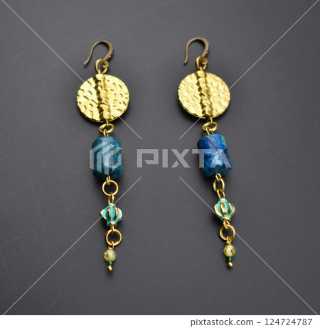 Unique earrings for women on a black background, promotional photo for an online vintage and handmade jewelry store 124724787