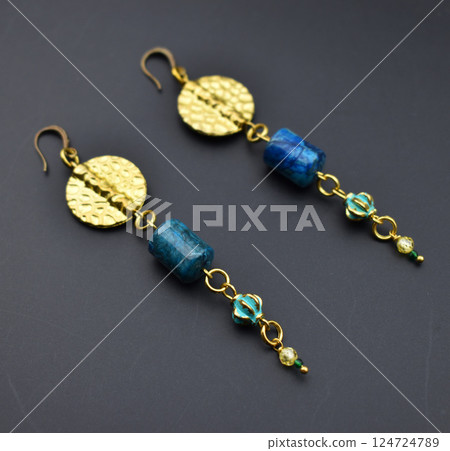 Unique earrings for women on a black background, promotional photo for an online vintage and handmade jewelry store Unique earrings for women on a black background, promotional photo for an online vintage and handmade jewelry store 124724789