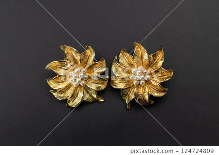 Unique earrings for women on a black background, promotional photo for an online vintage and handmade jewelry store Unique earrings for women on a black background, promotional photo for an online vintage and handmade jewelry store 124724809