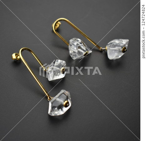 Unique earrings for women on a black background, promotional photo for an online vintage and handmade jewelry store Unique earrings for women on a black background, promotional photo for an online vintage and handmade jewelry store 124724824