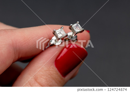 Unique earrings for women on a black background, promotional photo for an online vintage and handmade jewelry store 124724874