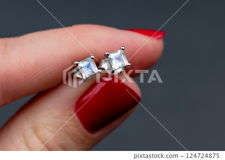 Unique earrings for women on a black background, promotional photo for an online vintage and handmade jewelry store 124724875