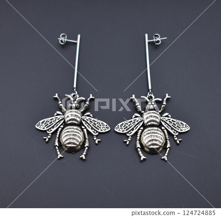 Unique earrings for women on a black background, promotional photo for an online vintage and handmade jewelry store 124724885