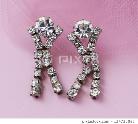 Unique earrings for women on a pink background, promotional photo for an online vintage and handmade jewelry store 124725085
