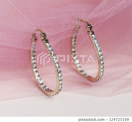 Unique earrings for women on a pink background, promotional photo for an online vintage and handmade jewelry store 124725109