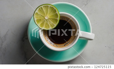 Cup of Coffee with Lime Slice on a Mint Saucer 124725115
