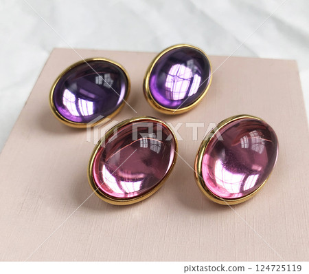 Unique earrings for women on a pink background, promotional photo for an online vintage and handmade jewelry store Unique earrings for women on a pink background, promotional photo for an online vintage and handmade jewelry store 124725119