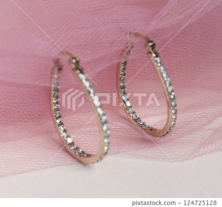 Unique earrings for women on a pink background, promotional photo for an online vintage and handmade jewelry store 124725128