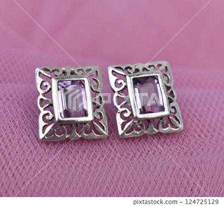 Unique earrings for women on a pink background, promotional photo for an online vintage and handmade jewelry store 124725129