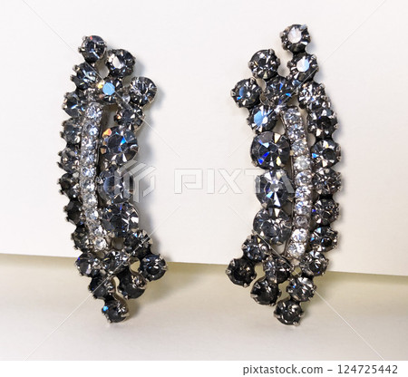 Unique earrings for women on a white background, promotional photo for an online vintage and handmade jewelry store 124725442