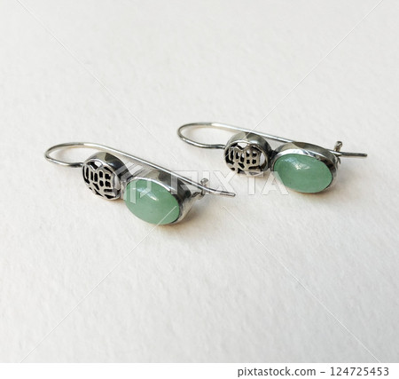 Unique earrings for women on a white background, promotional photo for an online vintage and handmade jewelry store 124725453