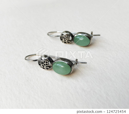 Unique earrings for women on a white background, promotional photo for an online vintage and handmade jewelry store 124725454