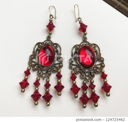 Unique earrings for women on a white background, promotional photo for an online vintage and handmade jewelry store 124725462