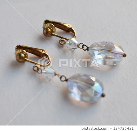 Unique earrings for women on a white background, promotional photo for an online vintage and handmade jewelry store Unique earrings for women on a white background, promotional photo for an online vintage and handmade jewelry store 124725481