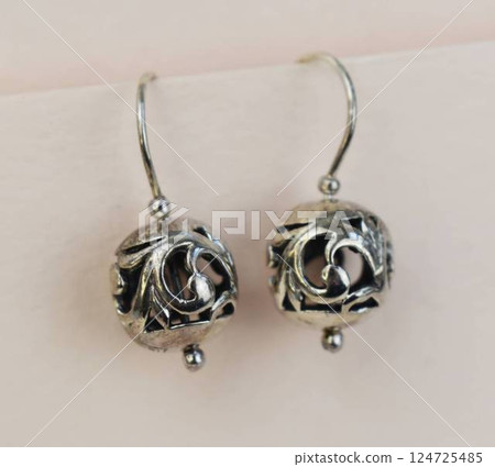 Unique earrings for women on a white background, promotional photo for an online vintage and handmade jewelry store Unique earrings for women on a white background, promotional photo for an online vintage and handmade jewelry store 124725485