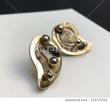 Unique earrings for women on a white background, promotional photo for an online vintage and handmade jewelry store Unique earrings for women on a white background, promotional photo for an online vintage and handmade jewelry store 124725502