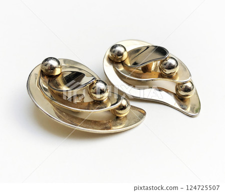Unique earrings for women on a white background, promotional photo for an online vintage and handmade jewelry store 124725507