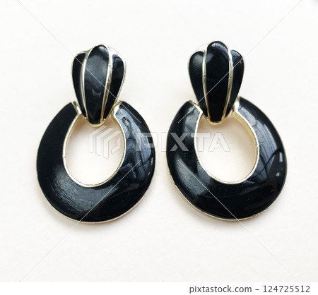 Unique earrings for women on a white background, promotional photo for an online vintage and handmade jewelry store 124725512