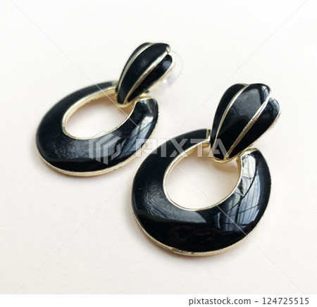 Unique earrings for women on a white background, promotional photo for an online vintage and handmade jewelry store 124725515