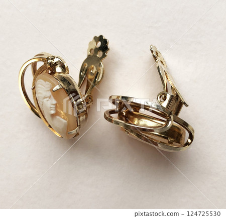 Unique earrings for women on a white background, promotional photo for an online vintage and handmade jewelry store 124725530