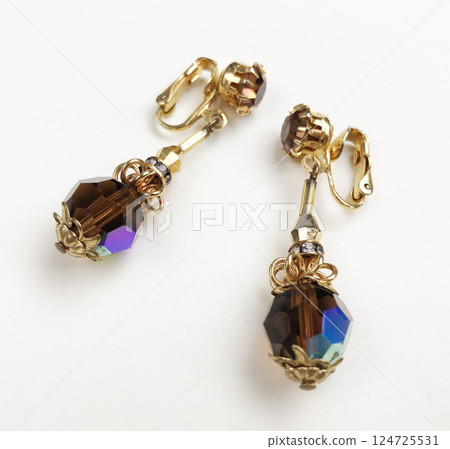 Unique earrings for women on a white background, promotional photo for an online vintage and handmade jewelry store 124725531