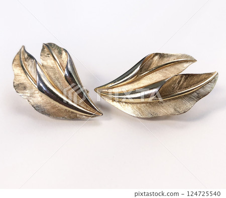 Unique earrings for women on a white background, promotional photo for an online vintage and handmade jewelry store 124725540