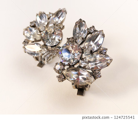 Unique earrings for women on a white background, promotional photo for an online vintage and handmade jewelry store 124725541