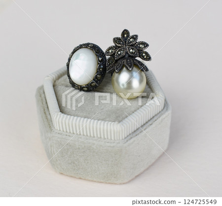 Unique earrings for women on a white background, promotional photo for an online vintage and handmade jewelry store 124725549