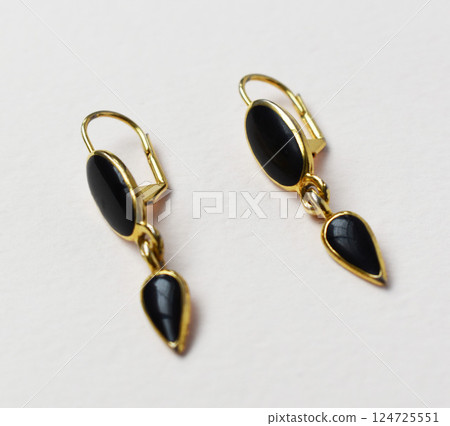 Unique earrings for women on a white background, promotional photo for an online vintage and handmade jewelry store Unique earrings for women on a white background, promotional photo for an online vintage and handmade jewelry store 124725551