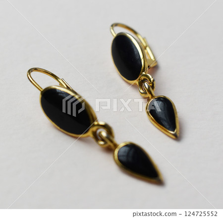 Unique earrings for women on a white background, promotional photo for an online vintage and handmade jewelry store Unique earrings for women on a white background, promotional photo for an online vintage and handmade jewelry store 124725552