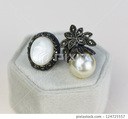 Unique earrings for women on a white background, promotional photo for an online vintage and handmade jewelry store Unique earrings for women on a white background, promotional photo for an online vintage and handmade jewelry store 124725557
