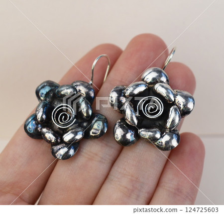Unique earrings for women on a white background, promotional photo for an online vintage and handmade jewelry store Unique earrings for women on a white background, promotional photo for an online vintage and handmade jewelry store 124725603