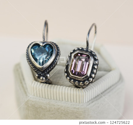 Unique earrings for women on a white background, promotional photo for an online vintage and handmade jewelry store 124725622