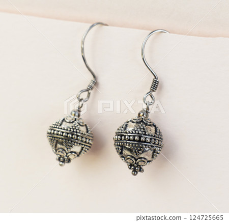 Unique earrings for women on a white background, promotional photo for an online vintage and handmade jewelry store 124725665