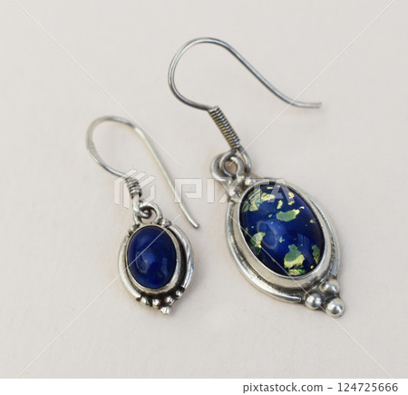Unique earrings for women on a white background, promotional photo for an online vintage and handmade jewelry store 124725666