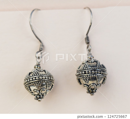 Unique earrings for women on a white background, promotional photo for an online vintage and handmade jewelry store 124725667