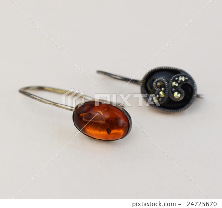 Unique earrings for women on a white background, promotional photo for an online vintage and handmade jewelry store 124725670